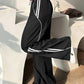 Retro sport black baggy jogging pants with side piping stripes