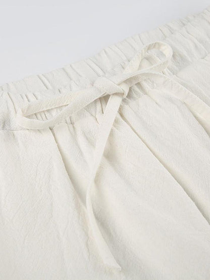 Pantalones blancos clásicos de pierna recta con cordón