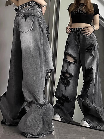 Jeans de novio rasgado negro con efecto lavado