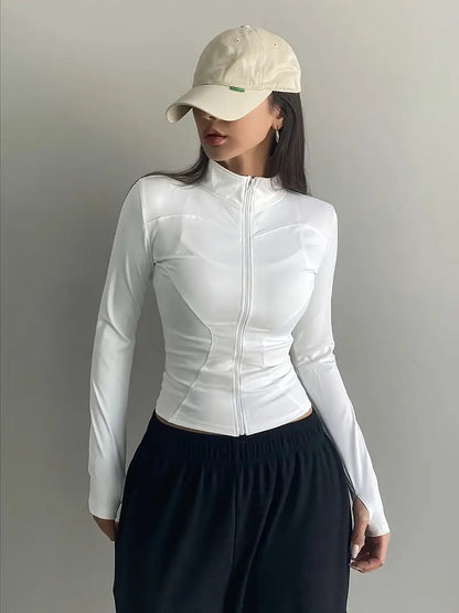 Top retro blanco de manga larga con cuello alto y cremallera