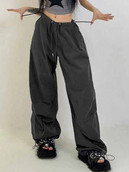 Pantalones cargo deportivos retro grises con cordones ajustables en los pies