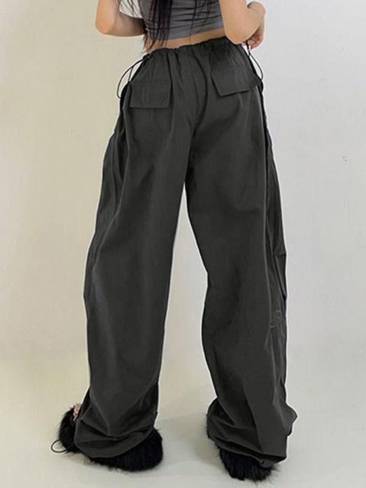 Pantalones cargo deportivos retro grises con cordones ajustables en los pies