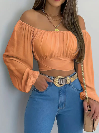 Blusa corta con hombros descubiertos y lazo en la espalda en color naranja 