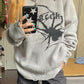 Gray punk rib knit sweater with printed spider