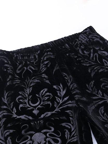 Pantalones acampanados de terciopelo con relieve vintage en color negro