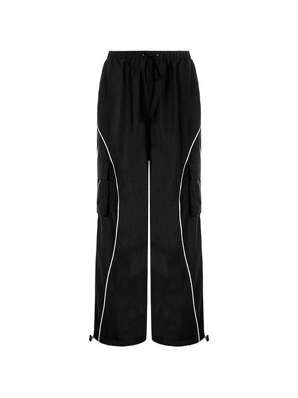 Black parachute trousers with cargo pockets and piping details